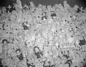 A sea of over 100 dolls collected to distribute at Christmas.  