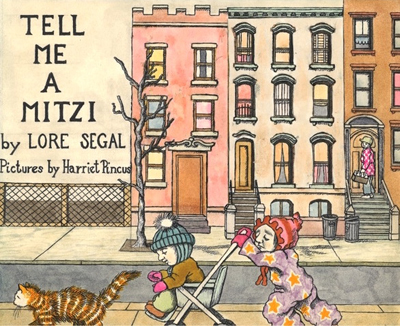 The image shows the front cover of Tell Me a Mitzi by Lore Segal and illustrated by Harriet Pincus. The watercolor illustration is of three New York brownstone houses. One is pink, one is white, and one is brown. On the stoop to the brown colored house, one can see a milkman delivering bottles of milk while examining Mitzi pushing Jacob in his stroller. In front of the stroller is a tabby cat. Jacob is wearing a blue knit hat with a white fluff ball on top. He is wears blue pants, a brown jacket, and pink gloves. Meanwhile, Mitzi seems to be burdened with pushing the stroller. Mitzi, too, is dressed warmly in a jump suit that is purple with gold stars on it. Her hat is pink with red piping. Matching the red piping are the red mittens on Mitzis hands.