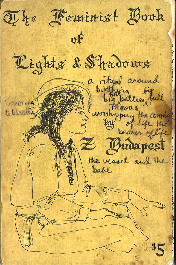 The cover of Zsuzsanna Budapest’s book titled The Feminist Book of Lights and Shadows. There is a sketch of the Goddess Diana dressed in a robe with spiritual energy crowning over her head. The writing reads, a ritual around birthing big full bellies, big full moons, worshipping by the coming of life, the bearer of life. Under the author's name reads: the vessel and the babe. The original price of $5 is indicated at the bottom right corner.