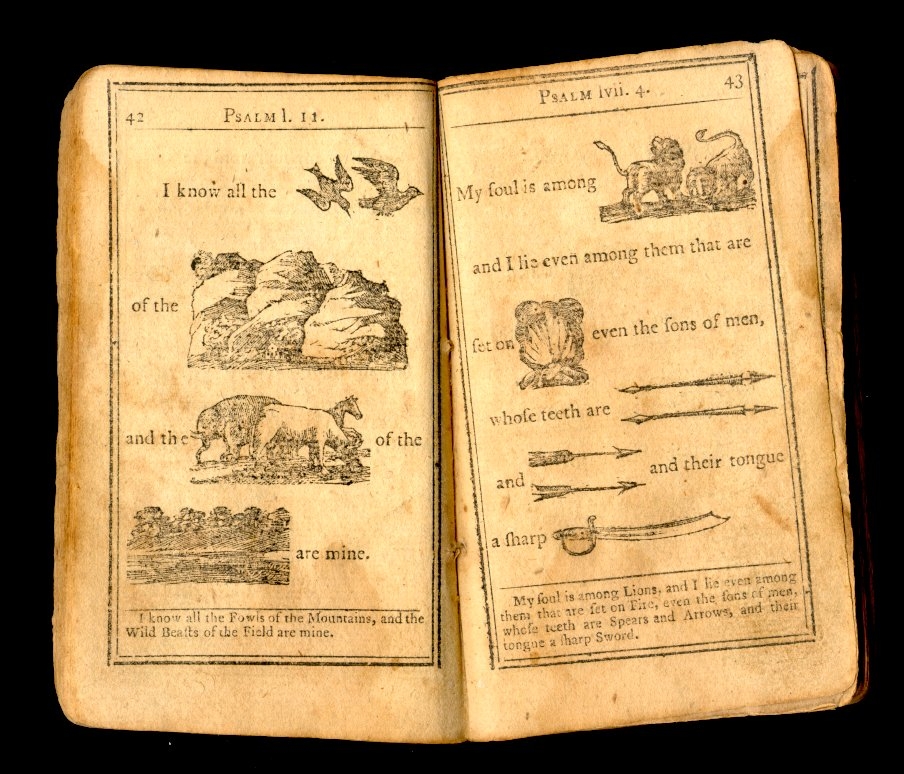 Two pages from a hieroglyphic bible. The first page reads Psalm I, II, page 42. I know all the (then birds are illustrated) of the (mountains are illustrated) and the (sheep are illustrated) of the (fields are illustrated) are mine. The second page reads My soul is among (lions are illustrated) and I lie even among them that are set on (fire is illustrated) even the sons of men whose teeth are (daggers are illustrated) and (arrows are illustrated) and their tongues a sharp (sword is illustrated) 